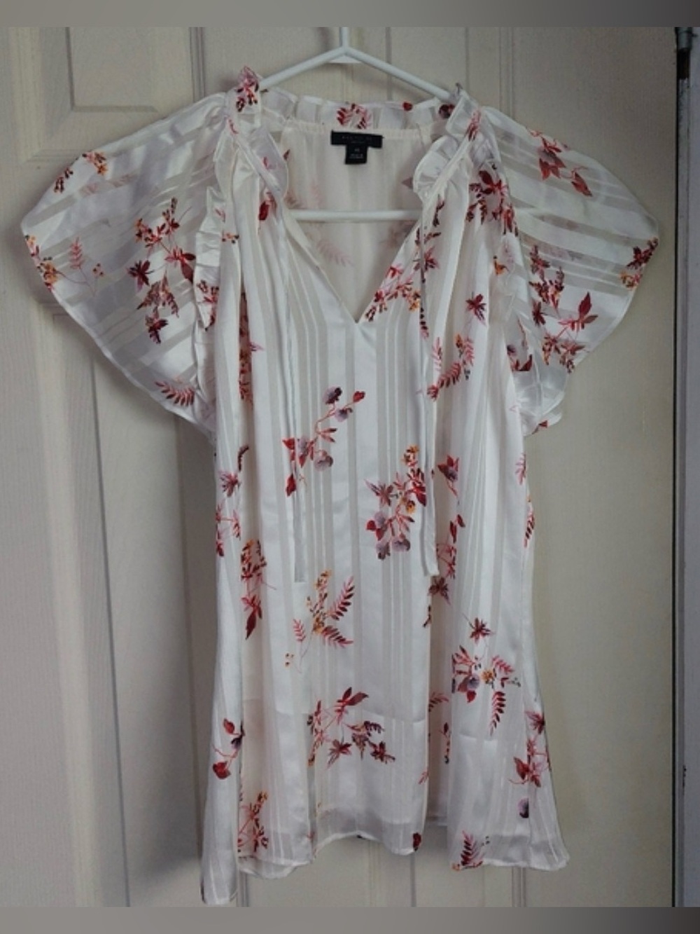 Ann Taylor Factory white floral flutter sleeve blouse.